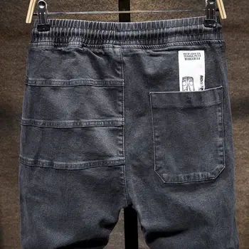 Jeans pánske elastické hip hop nohavice pánske voľné bežné nohy pevne pás trend jar a na jeseň nové 2020